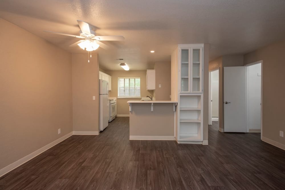 Living and dining room with shelving at Auburn Townhomes in Auburn, California