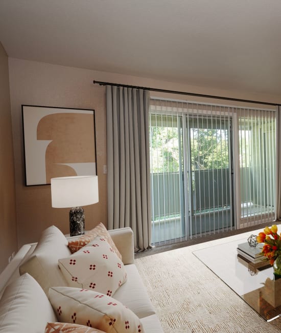 Spacious living room with balcony at Castle Hill Apartments in Sacramento, California