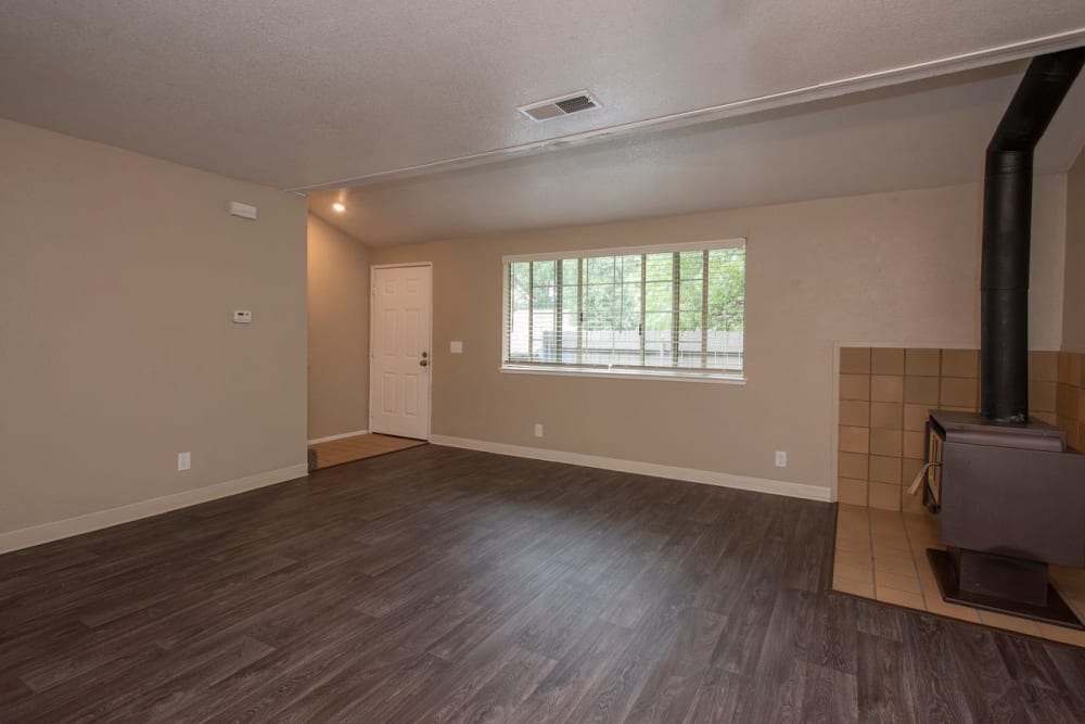 Spacious living room with fireplace in home at Auburn Townhomes in Auburn, California