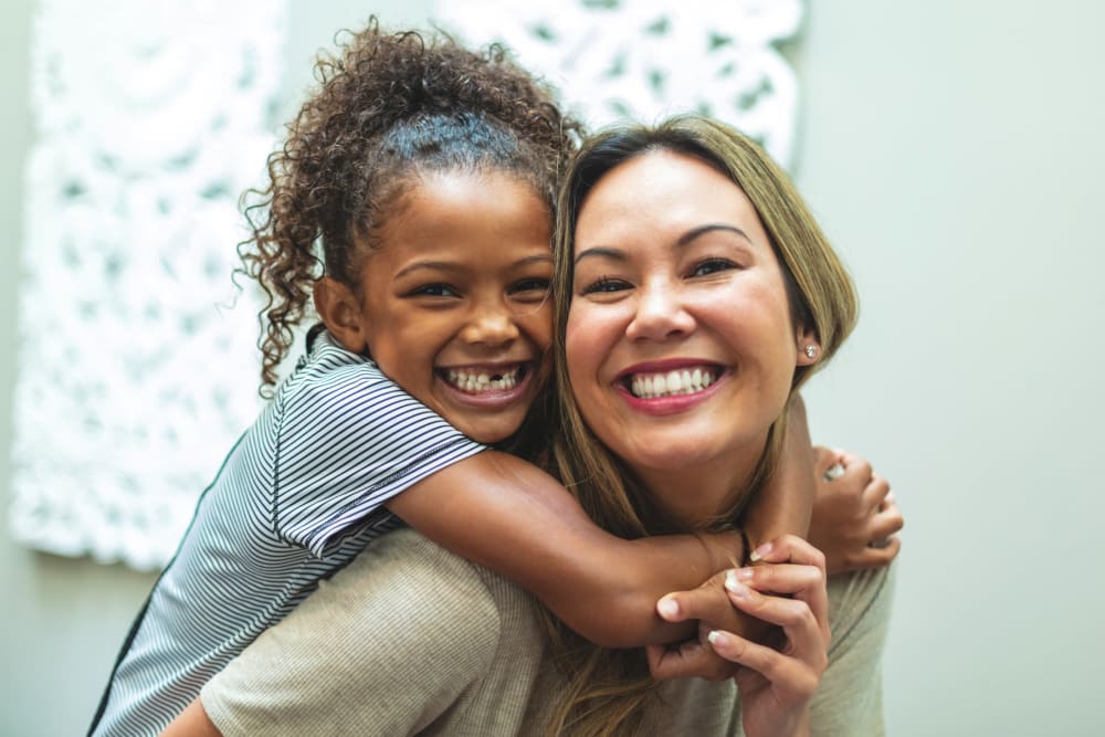 Happy family and residents of Ray Stone Apartments