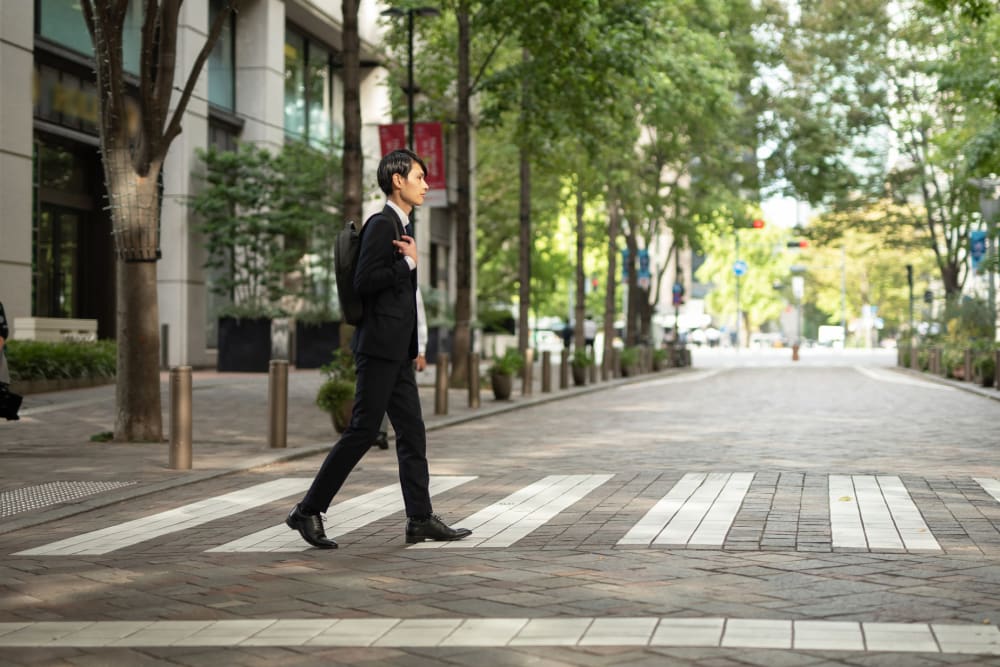 Ray Stone Apartments resident walking happily downtown