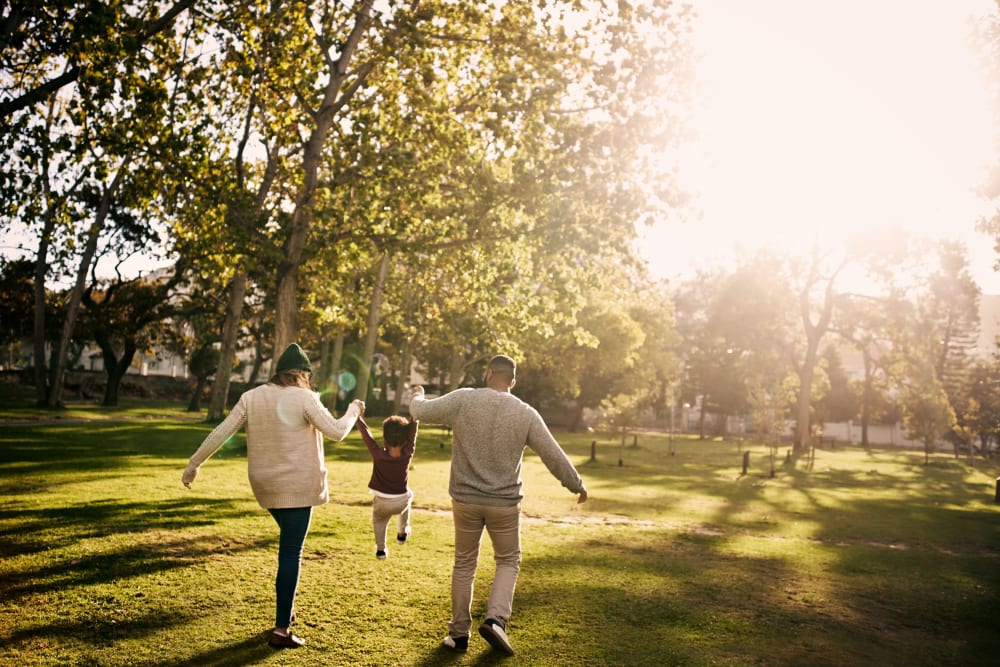 Residents walking in park near Country Club Gardens in Sacramento, California