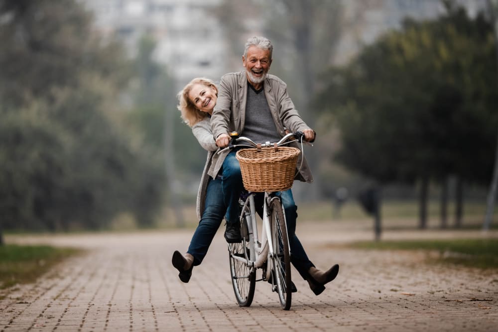 Happy residents of Ray Stone Apartments riding bikes