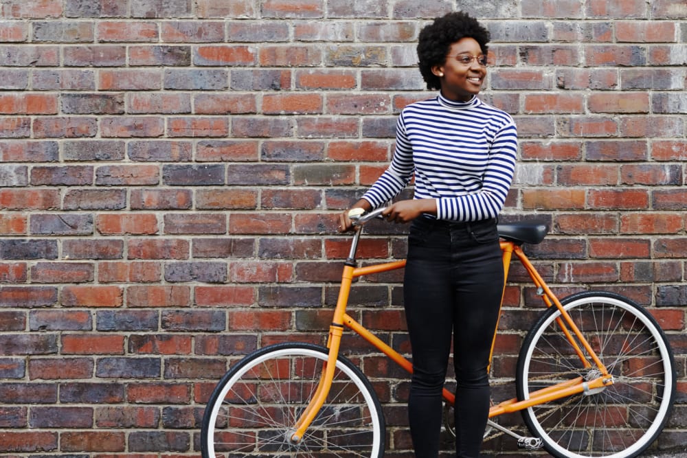 Resident riding bike near Clarendon House in Sacramento, California