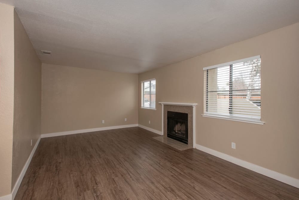 Living room with fireplace at River's Edge Apartments in Lodi, California