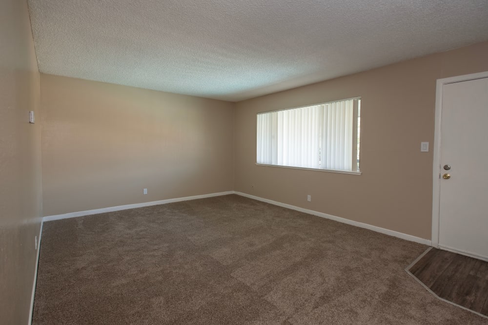 Spacious living room at Corabel Lane Apartments in Sacramento, California