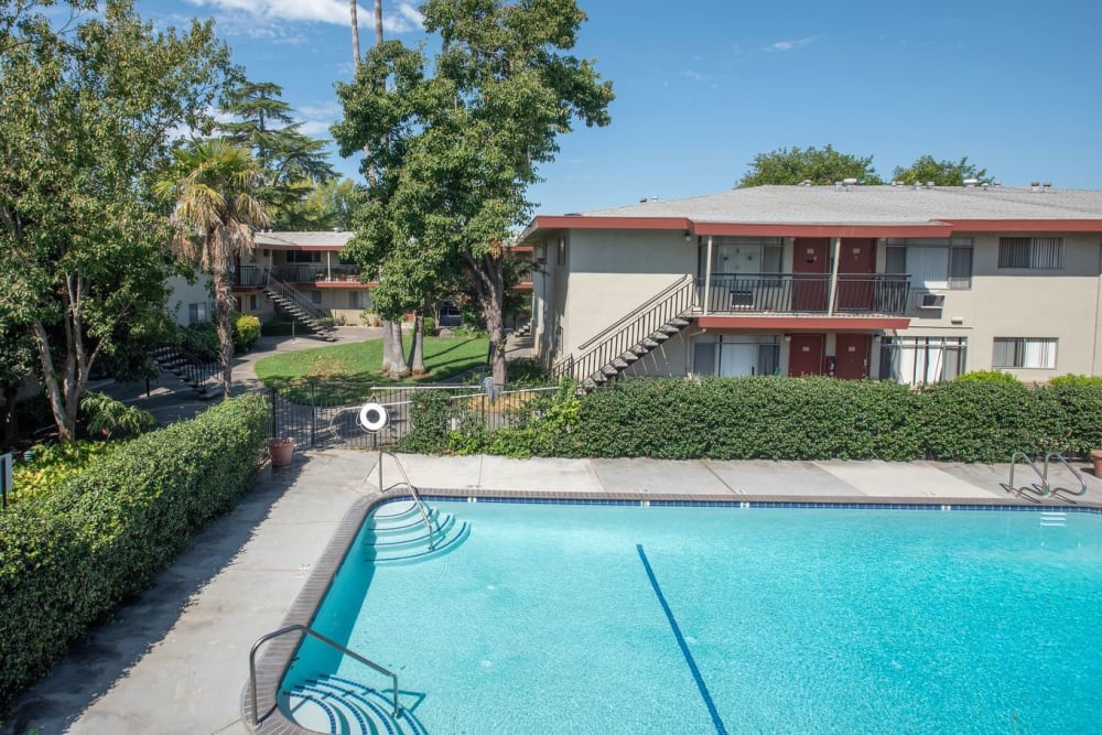 Swimming pool area at Corabel Lane Apartments in Sacramento, California