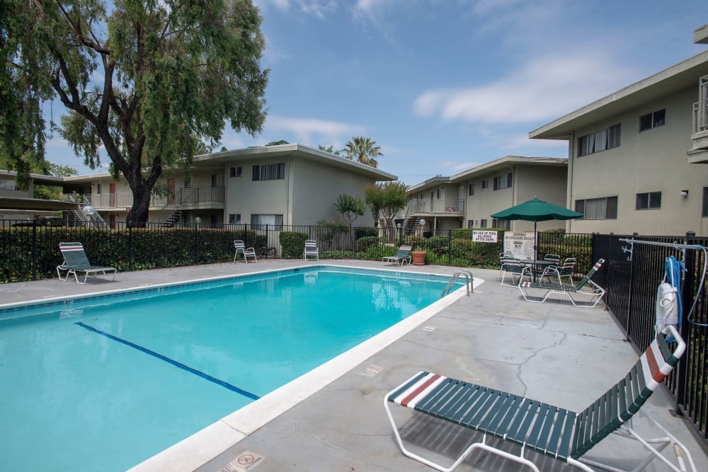 Pool chairs and tables at Country Club Gardens in Sacramento, California