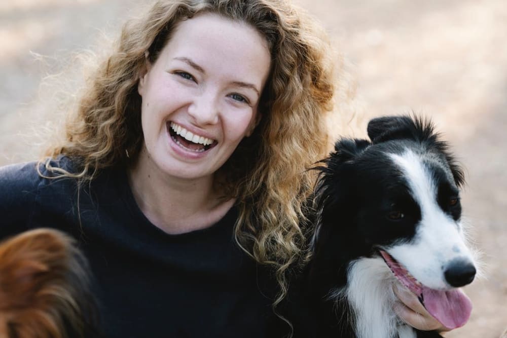 Woman with her dog at Meritage Apartments in Lodi, California