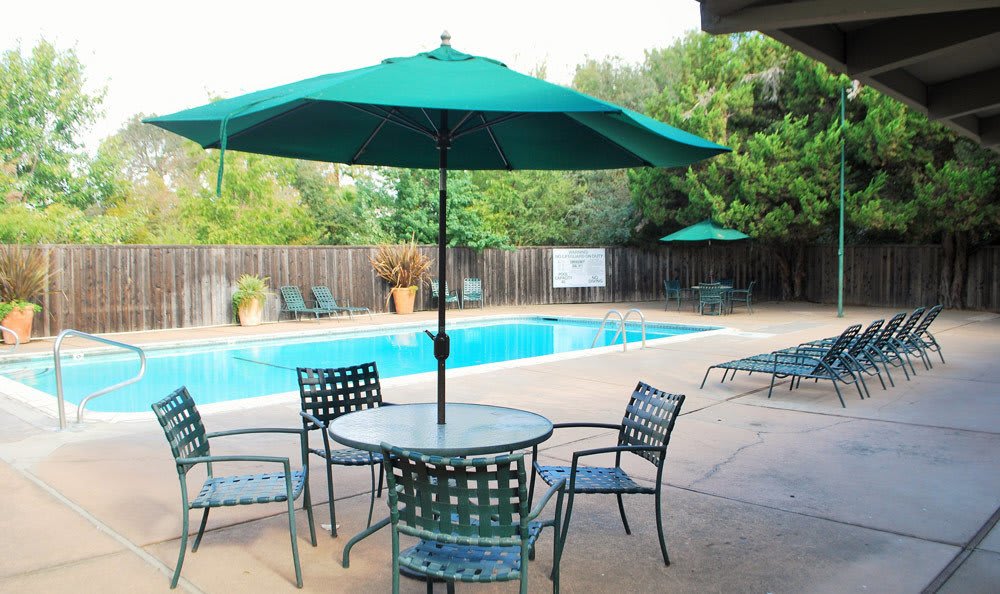 Pool patio table at Castle Hill Apartments in Sacramento, California