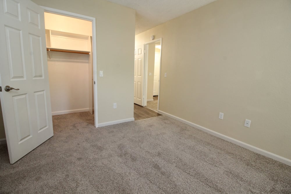 Bedroom and closet at Huntcliffe Apartments in Fair Oaks, California